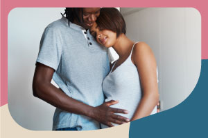 Couple, man with hand on woman's pregnant belly, no logo