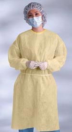 An adult wearing a yellow surgical gown, a hair net, and a surgical mask.