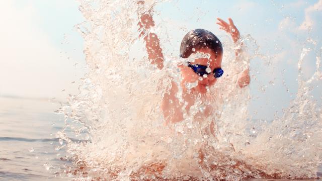 Child splashing in lake