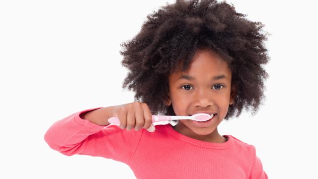 child brushing teeth