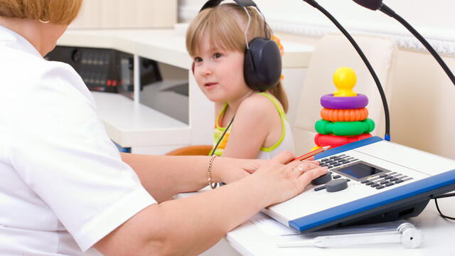 A child's hearing is being tested.