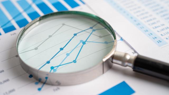 Magnifying glass laying over a chart