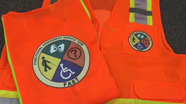 Functional Assessment Service Team orange vest.