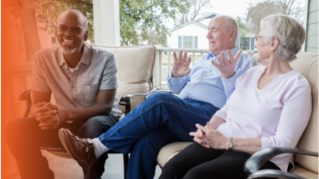 Three people talking on a porch