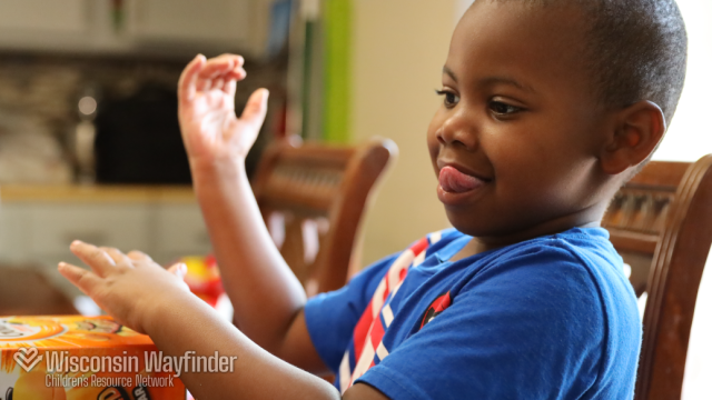 Wisconsin Wayfinder: Child Playing at Kitchen Table