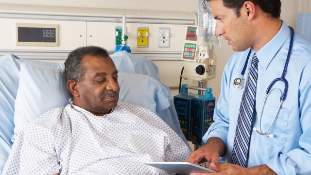 Doctor consulting with a patient in hospital