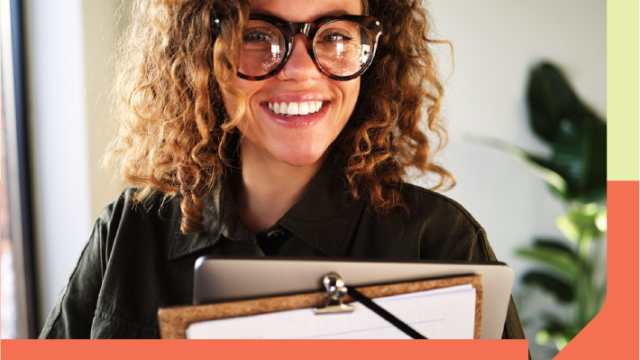 Person holding a computer and a clipboard