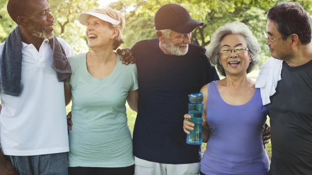 Five adults, post exercise, with water and towels