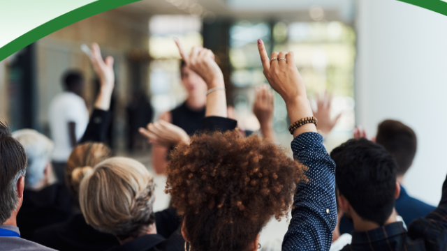 Tobacco Program image showing a group of people from the back with their hands raised