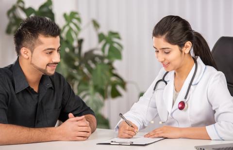Doctor consulting with a patient in her office