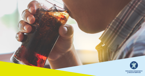 Close up of a child drinking a glass of soda