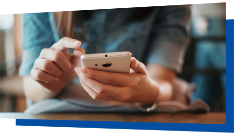 Close up of hands holding a smart phone