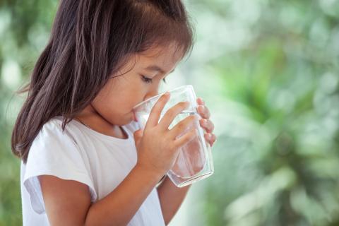 Young child drinking water