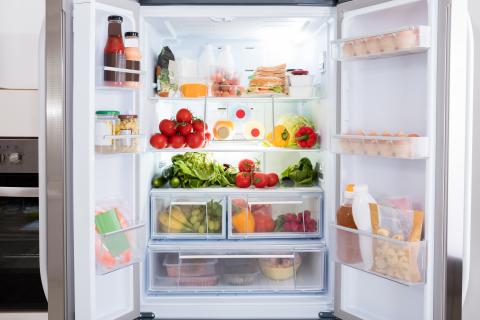 French door refrigerator full of fruits and vegetables