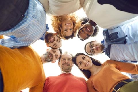 A group of adults gathered in a circle