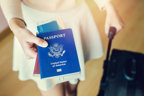 Close up of US passport and boarding pass inside the book