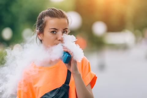 Young female adult vaping