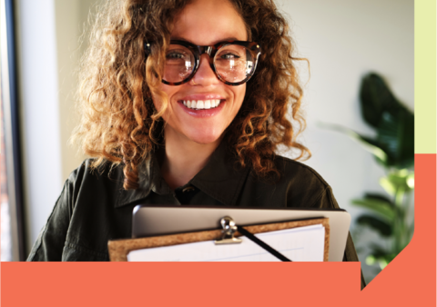 Person holding a computer and a clipboard