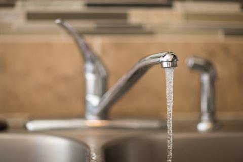 Water running from a faucet.