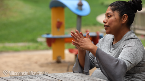 Wisconsin Wayfinder: Parent Sits at Picnic Table