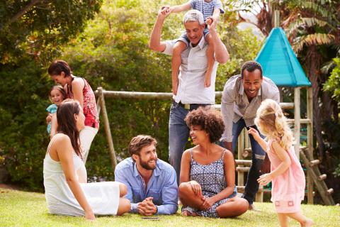 Adults and children enjoy playing outside.