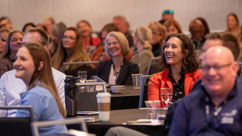 Deputy Medicaid Director Amanda Dreyer smiles during a presentation at the HCBS Innovation Grant Summit