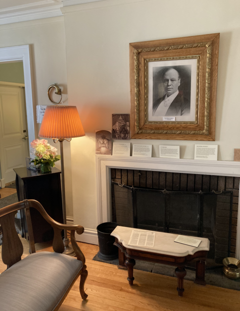 Seating area around a fireplace at the Julaine Farrow Museum