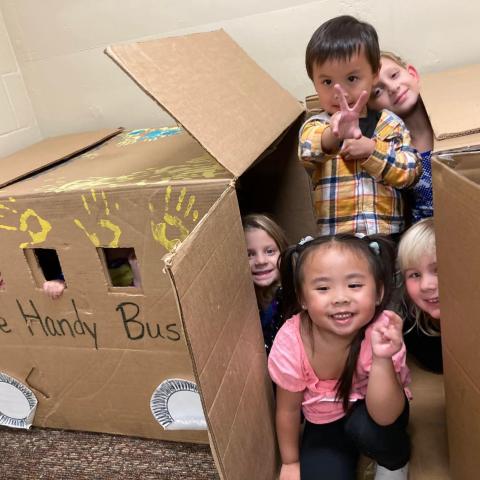 Dunn Birth to 3 ARPA Grants: Kids playing with box