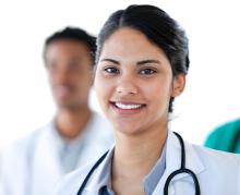 doctor smiles with stethoscope around neck