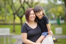 Adult and young child in the park