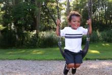 Young boy on swing
