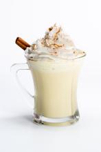 Holiday Eggnog with whipped cream and cinnamon stick