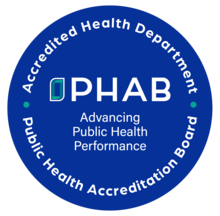 Public Health Accreditation Board logo showing a blue circle with the following text in the center "Advancing Public Health Performance"