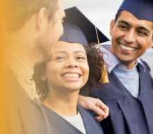 Smiling people wearing caps and gowns