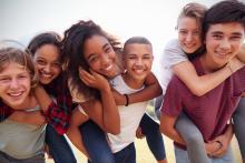 Three sets of teens giving piggyback rides