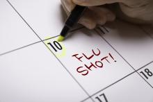 Flu shot note on calendar, yellow highlighter circling date