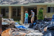 Cleaning out a house after a flood.