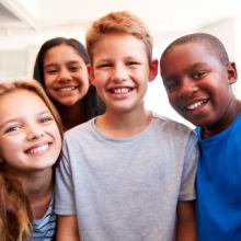 Group of smiling elementary kids