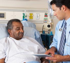 Doctor consulting with a patient in hospital