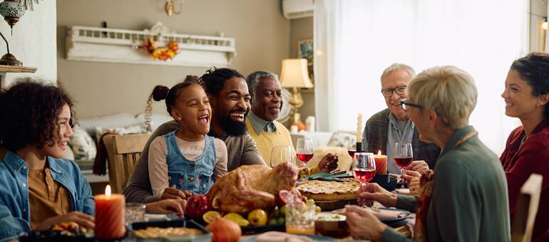 Family enjoying a holiday dinner Family enjoying a holiday dinner